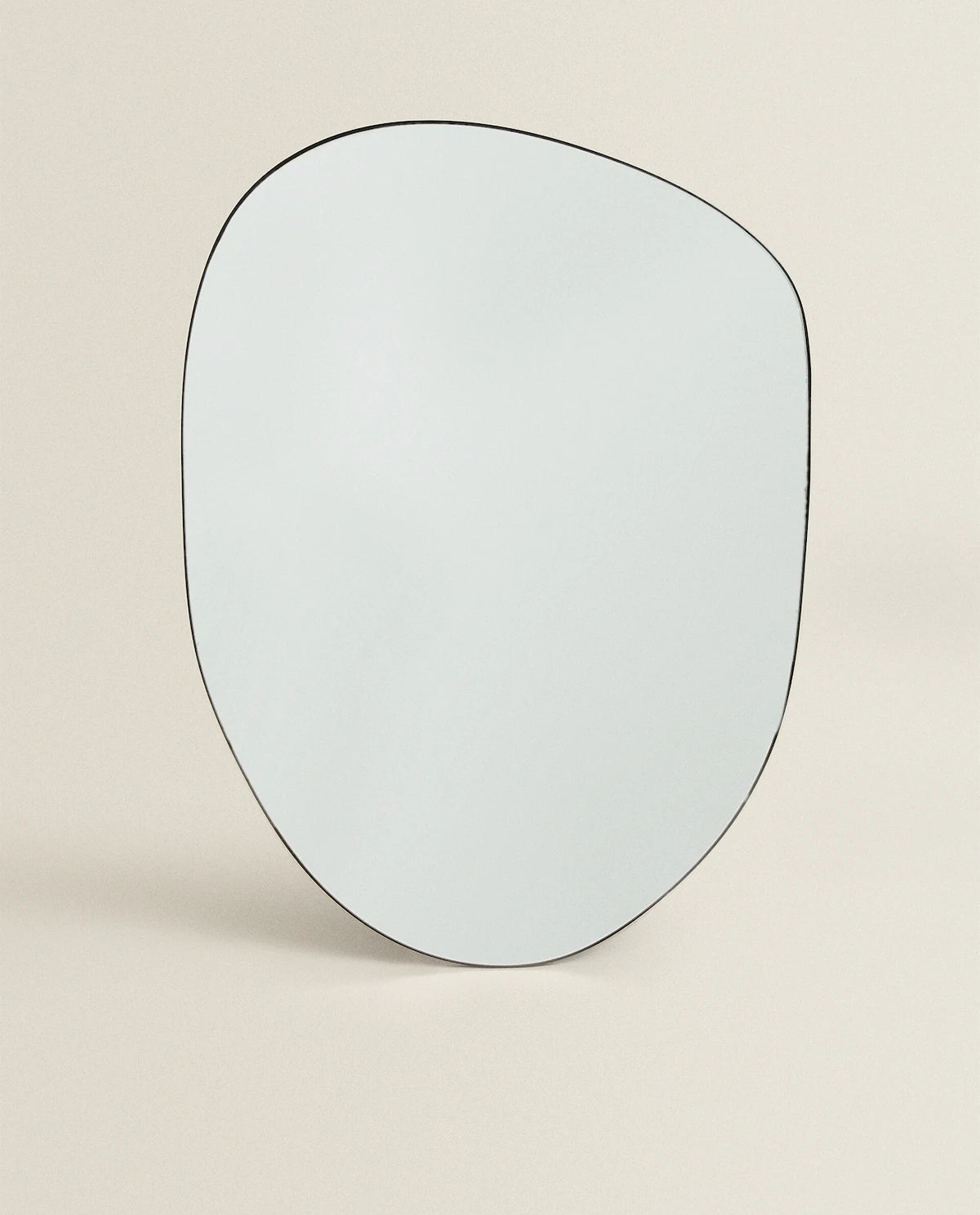 Large asymmetrical wall mirror