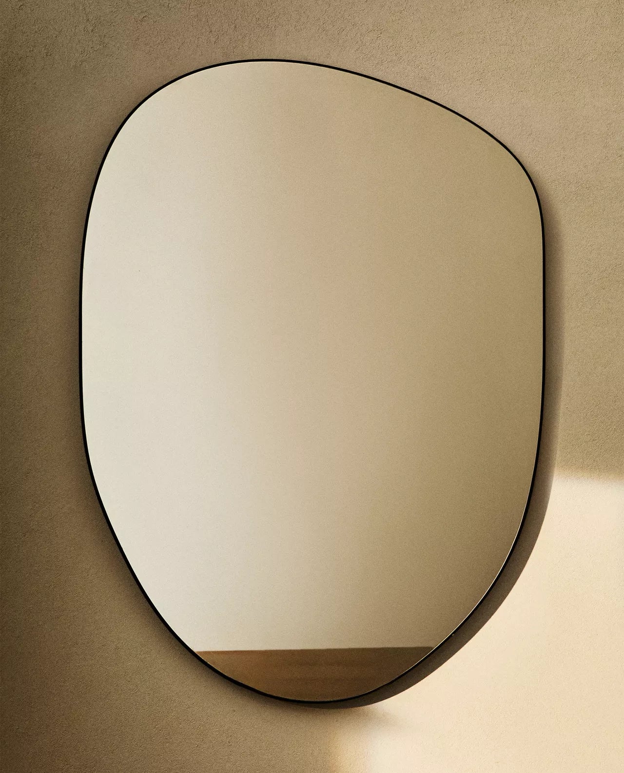 Large asymmetrical wall mirror